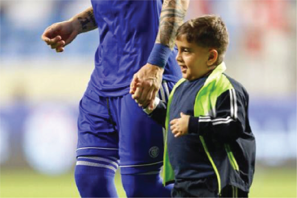 Cancer patient plays football with heroes